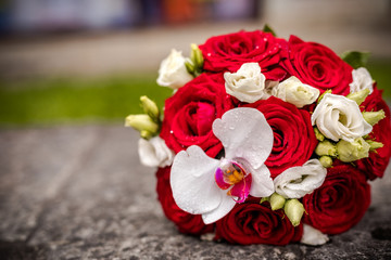 Beautiful bouquet of fresh flowers on a stone slab.