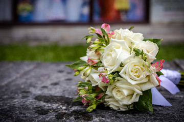 Beautiful bouquet of fresh flowers on a stone slab.