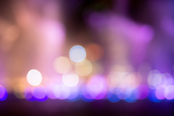 Fountain show with red bokeh color light illumination abstract.