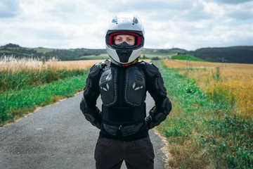 Girl driver portrait, protective equipment, turtle. body armor jacket. Adventure motorbike gear. a motorcycle tour journey. Outdoor. World travel, freedom concept. safety first, safe driving