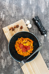 Paella with chicken, seafood and chorizo