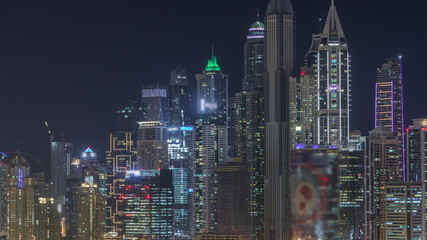 Dubai Marina skyscrapers and golf course night timelapse, Dubai, United Arab Emirates
