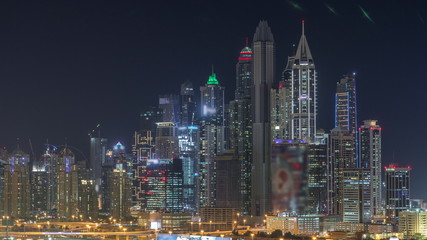 Fototapeta na wymiar Dubai Marina skyscrapers and golf course night timelapse, Dubai, United Arab Emirates