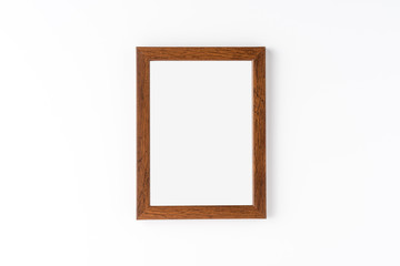 Empty picture frame on white wall