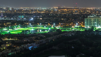 Aerial view to villas and houses with Golf course night timelapse