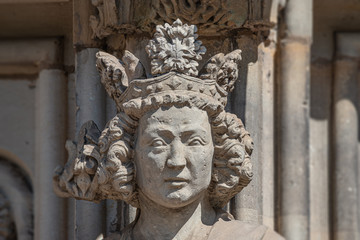 Wall figure of the queen at main facade of catholic cathedral in Magdeburg, Germany, closeup,...