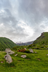 Fototapeta na wymiar Mountains rocks landscape with cloudy dramatic sky