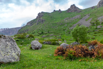 Fototapeta na wymiar Mountains rocks landscape with cloudy dramatic sky