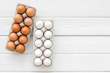 Farm products with eggs on white wooden background top view mock up