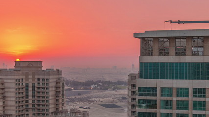 Fototapeta premium Sunrise over towers in Greens district aerial view from top timelapse.