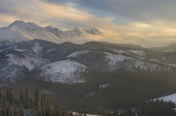 A warm light of a sunset in winter mountains - Tatra mountains in Poland.