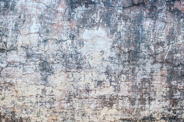 grijze textuur van oude muur met gebarsten gips