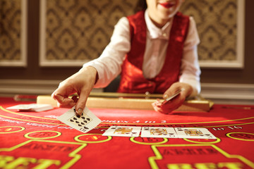 The croupier in the casino does a shuffle of cards