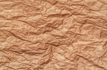 Texture of beige crumpled paper. Vintage background