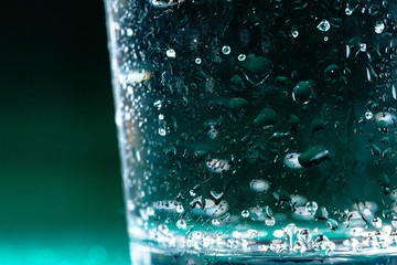 Close up of a sparkling water bottle with condensation on it