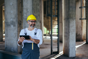 construction worker using tablet on site
