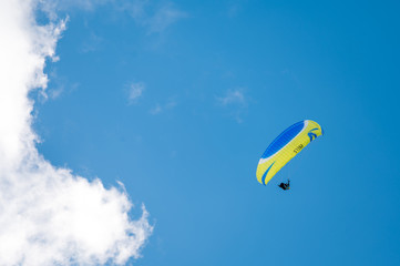 paraglider in the blue sky