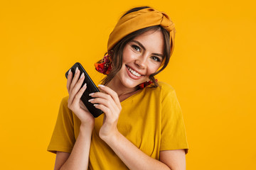 Portrait of a pretty young girl casualy dressed standing isolated