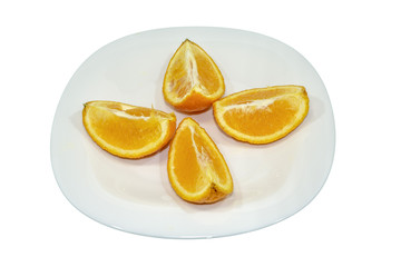 Four orange fruit segments isolated on white plate. Clipping Path