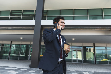 Side view happy lawyer talking on the phone outdoors