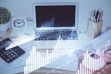 Forex Chart hologram on table with computer background. Multi exposure. Concept of financial markets.