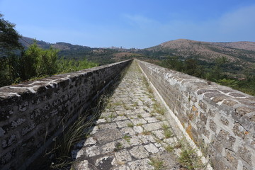 Fototapeta na wymiar Maddaloni, Italy - 12 August 2019: The Carolino aqueduct created for the complex of San Leucio and the Royal Palace of Caserta