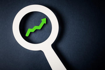 Checking chart with magnifying glass