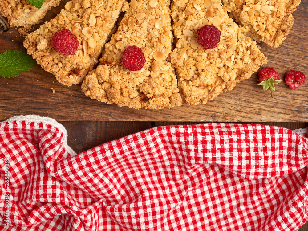 Poster sliced triangular pieces of crumble pie with apples