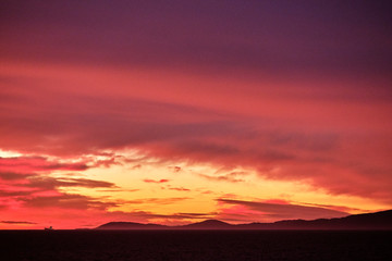 Sunrise seen from the cruise ship near Stewart Island (Rakiura), New Zealand