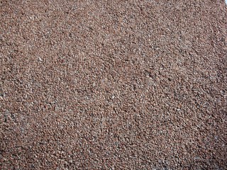 Granite crumb in the wall. Granite stone, wall of granite.