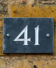 House number 41 on black slate