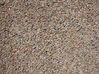 Granite crumb in the wall. Granite stone, wall of granite.