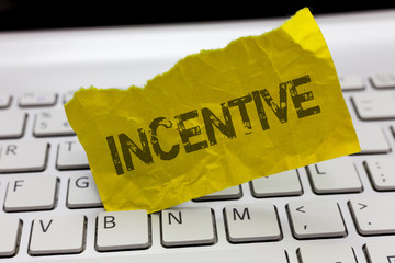 Text sign showing Incentive. Conceptual photo thing that motivates or encourages someone to do...