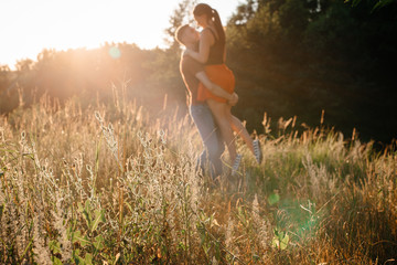 young couple man and woman dancing in a summer pine forest