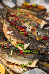 Fried fish with red berries