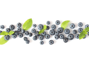 blueberry and mint leaves on a mulberry background top view. Berries.