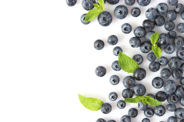 blueberry and mint leaves on a mulberry background top view. Berries.