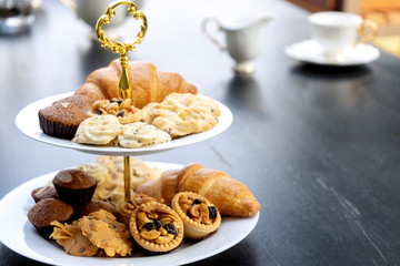 High tea set are on the black table