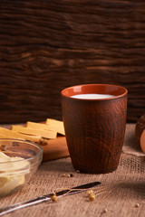 Assorted dairy products milk, cheese, butter rustic still life on table