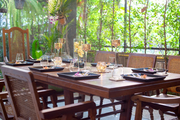 Dinner set on the wood table with long wine glass
