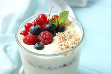 yogurt with berries on the table.