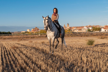 young woman on horseback