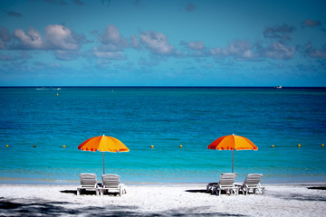 Parasols and sand beach in Mauritius island