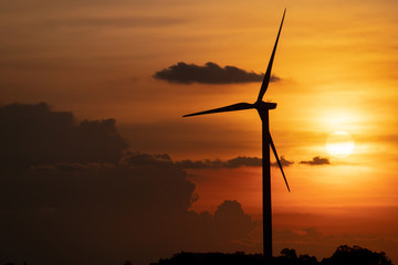 silhouette of wind turbine located on a ridge with wind blowing all the time. Making it able to...