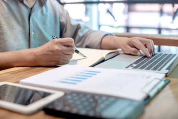 Businessman in casual style working with graph