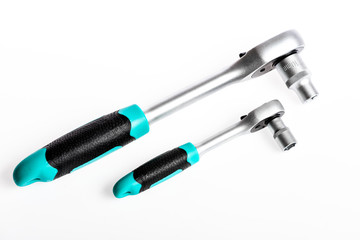 Socket spanner wrenches white background. Knob for socket wrench nut ratchet close up. Ratchet wrench. Ratchet tool. Steel made with no skid threaded handle you can hold them firmly without slipping