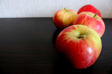 Ripe red apples on a table. Place for your text.	
