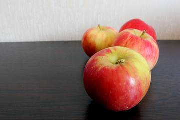 Ripe red apples on a table.  Place for your text.