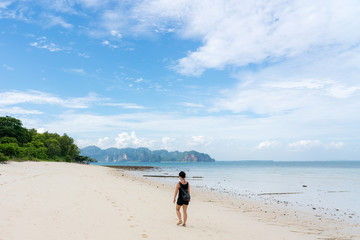 young cute hipster girl travelling at beautiful blue sky paradise tropical  coast beach PP Island Krabi Phuket Thailand guiding idea for long weekend  female relax rest woman women planning life