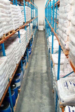 Barrel and goods arranged on a rack in warehouse